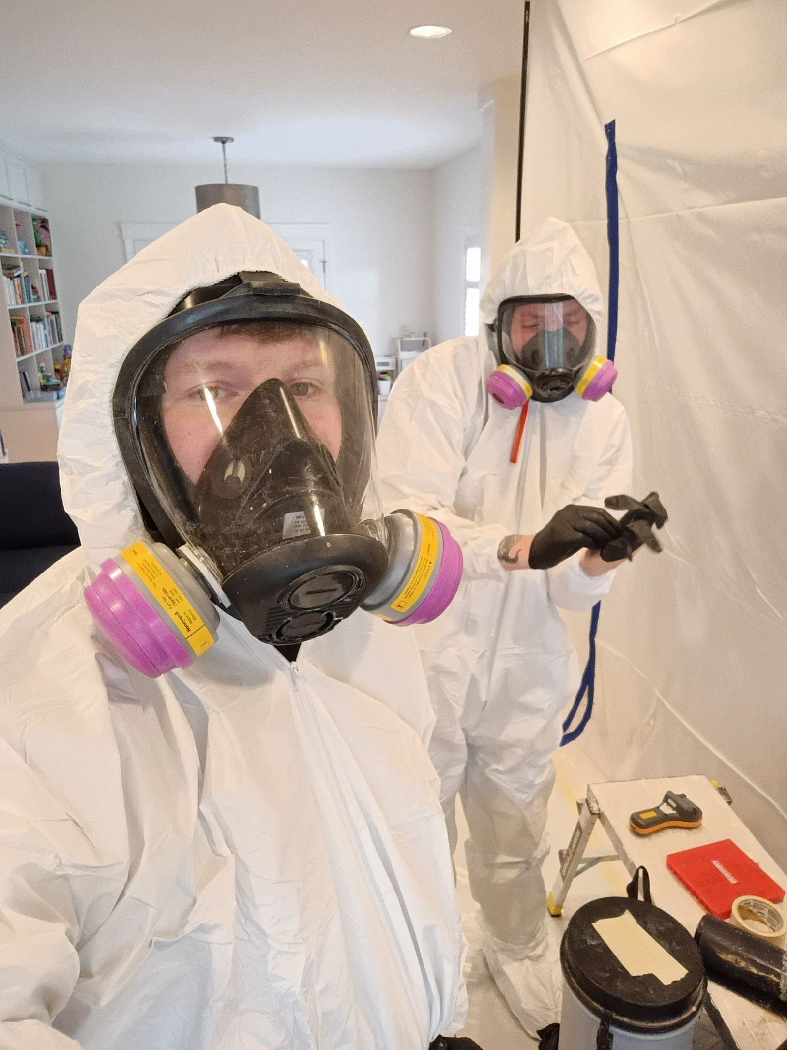 Flagship Environmental technicians in full protective equipment during a containment setup